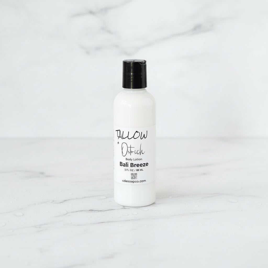 White lotion bottle with black cap on a marble surface