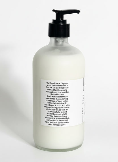 Bottle of body lotion with a pump on a white background