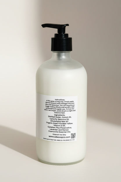 White bottle with black pump on a beige background