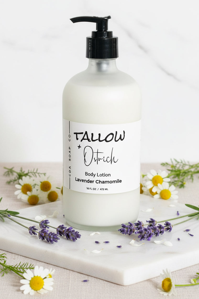 Lavender chamomile Body lotion bottle with 'Tallow & Ostrich' label on a marble surface with flowers.