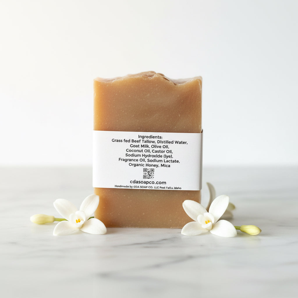 Bar of soap with a label on a white background with flowers